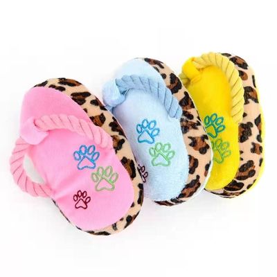 Gli animali domestici che molari del cane la peluche gioca le pantofole vocali della peluche mordono resistente